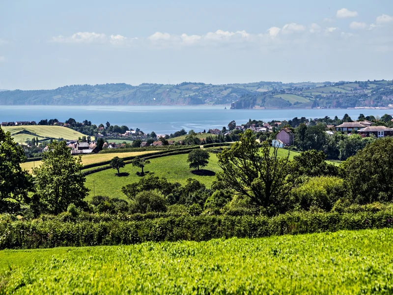 A View From The Road Overlooking Budleigh On a Hot Summer Day